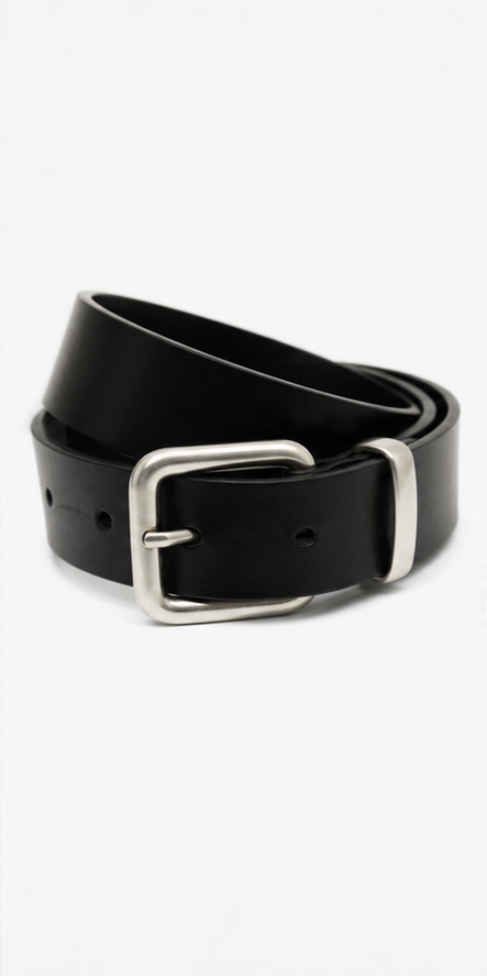A clean leather belt that fixes the outfit without announcing it.